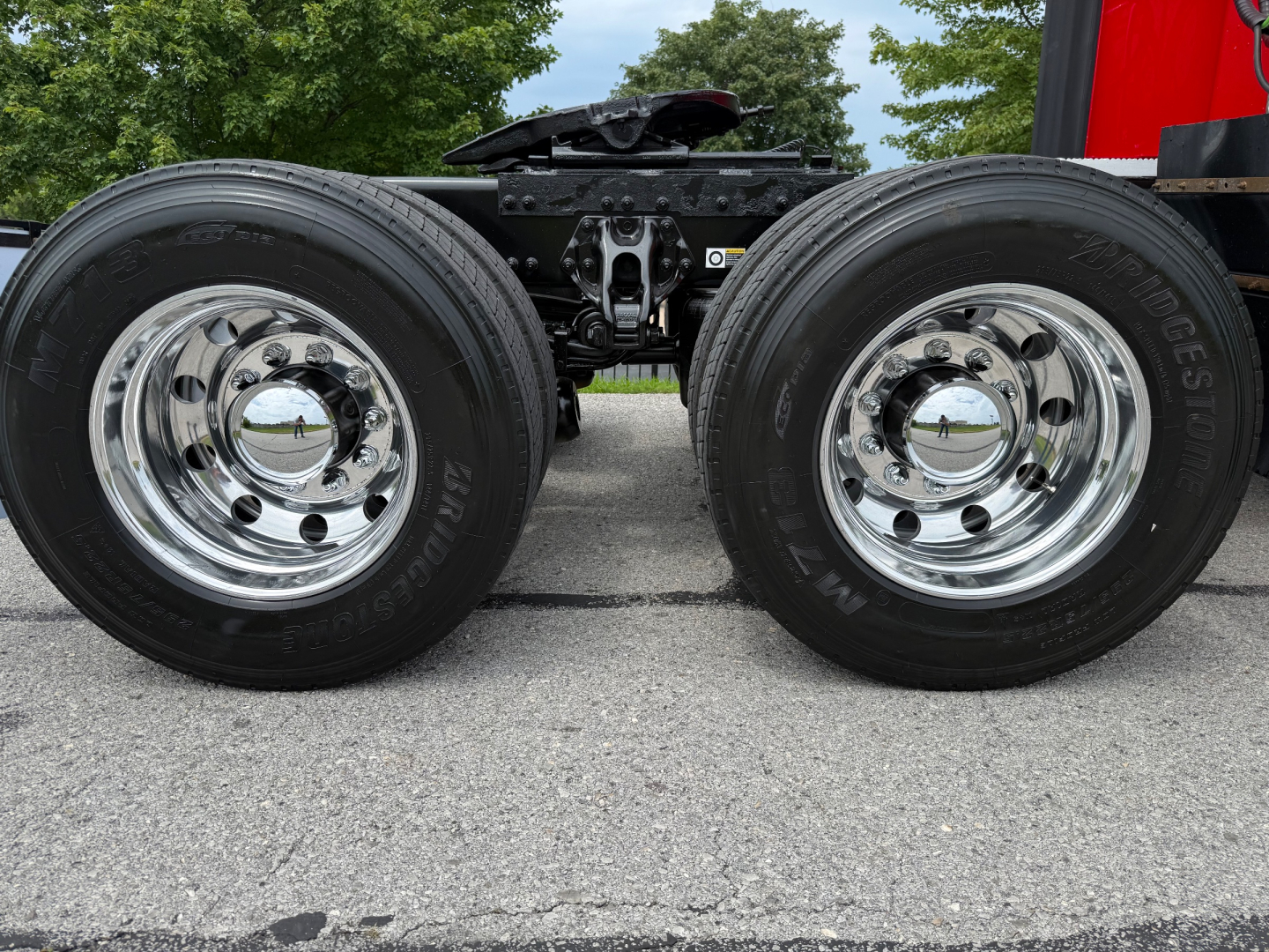 Peterbilt 579 truck chassis dual rear wheels showing chrome wheels and tires.