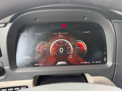 Peterbilt 579 digital gauge cluster showing 0 mph and various indicators in the center display