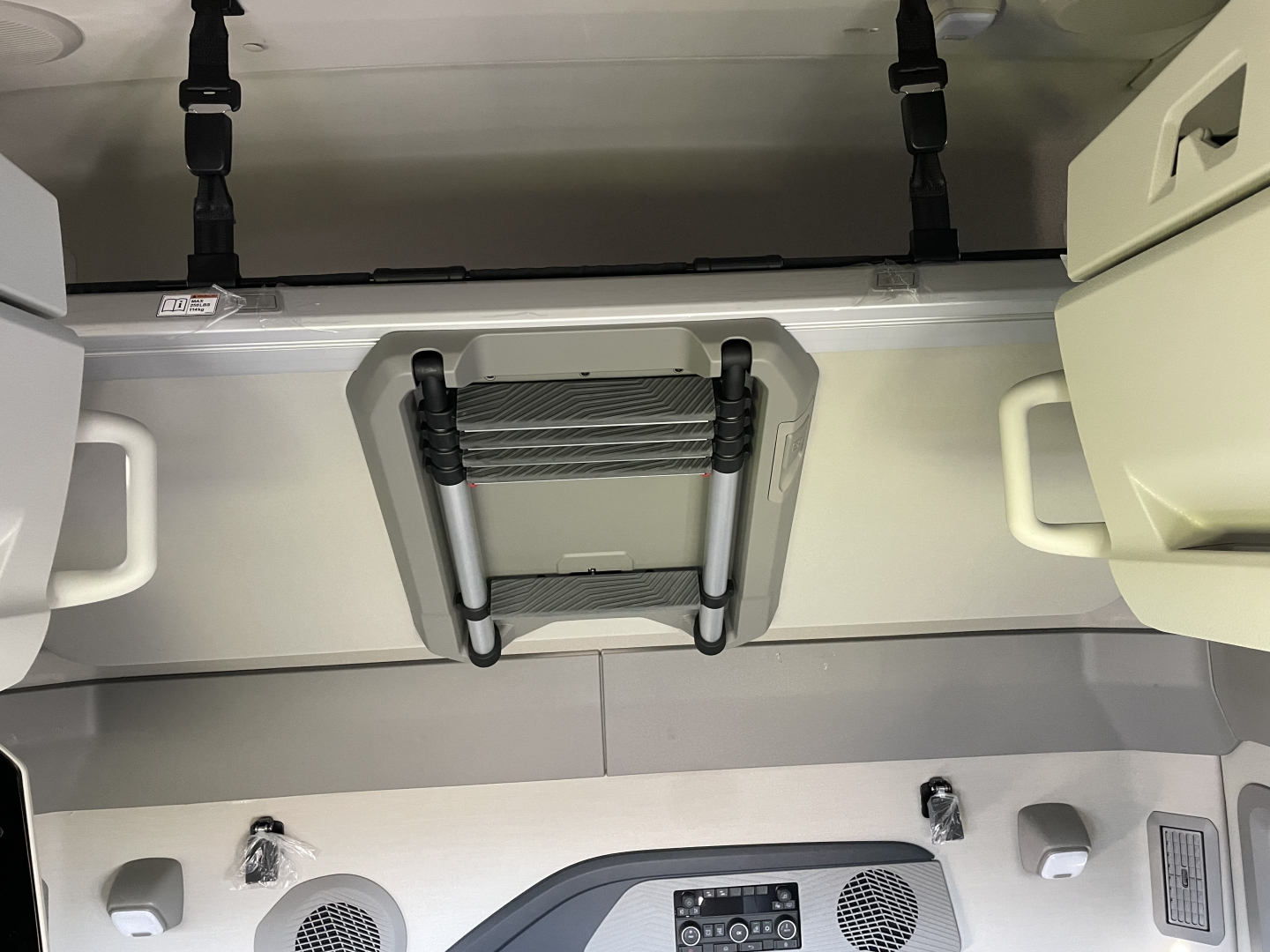 Volvo VNL64T660 sleeper cab area with overhead storage, ladders, and interior ducts; visible text includes VIN/stock on listing and interior components.