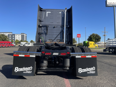 Rear view of a new 2026 Volvo VNL64T660 conventional sleeper truck showing dual rear axles and mudflaps with Bruckner's Truck Equipment logo.