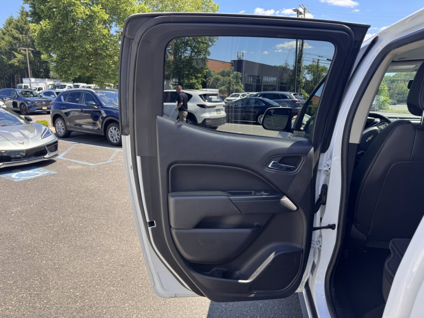 Chevrolet Colorado 2018 pickup truck door panel and open rear door view showing interior and exterior side profile.