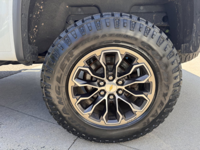Chevrolet Colorado wheel and tire close-up showing rugged all-terrain tire with multi-spoke alloy rim