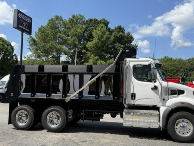 Western Star 47X dump truck in side profile view showing cargo bed and cab with chrome steps