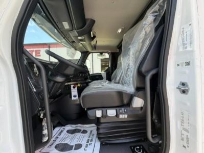 Western Star 47X truck interior front cab view showing driver seat and controls with plastic seat covering.
