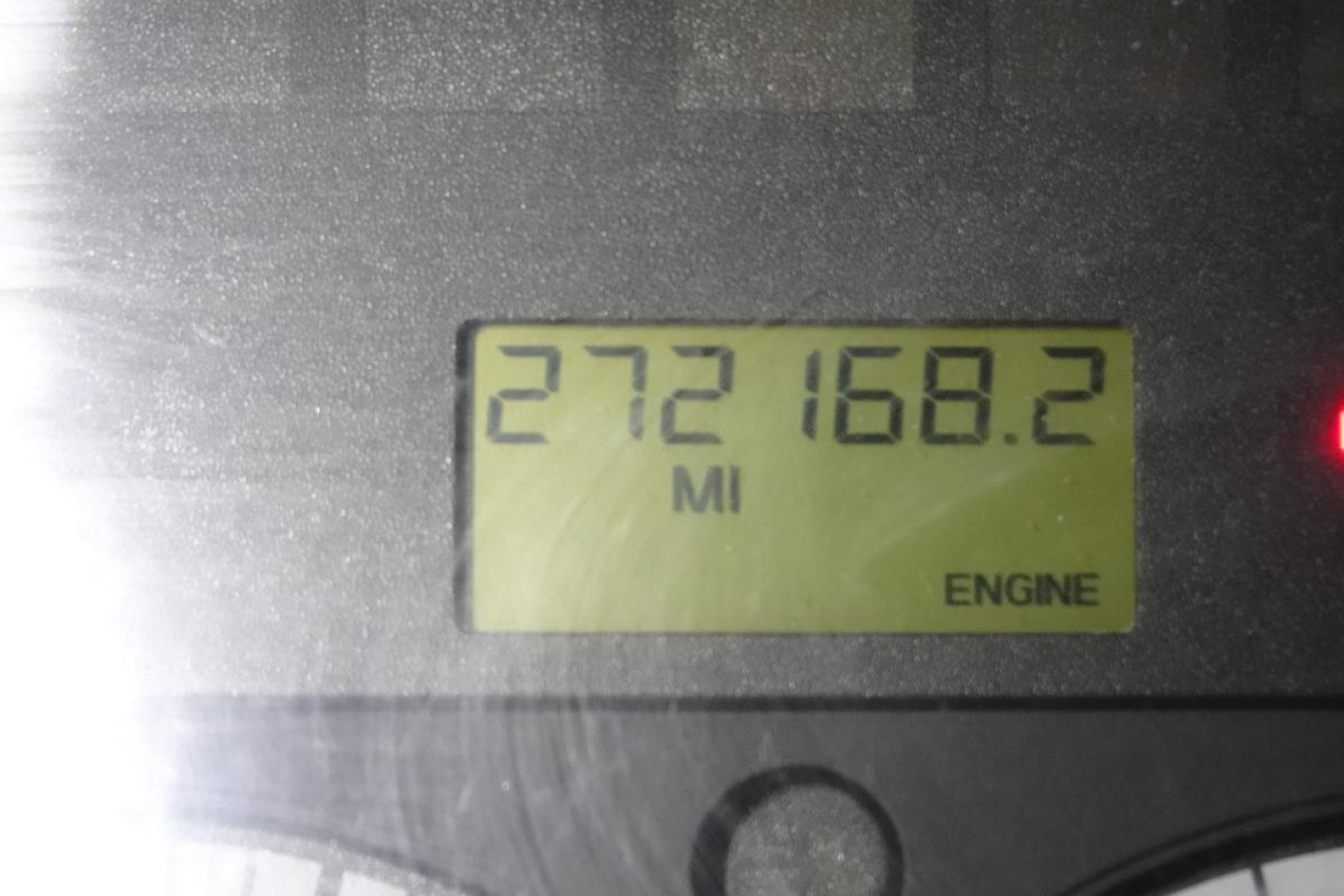 Dashboard odometer showing 272168.2 miles and engine indicator on display.