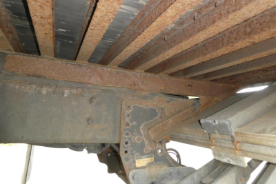 Freightliner M2 106 truck chassis undercarriage showing steel frame and brackets.