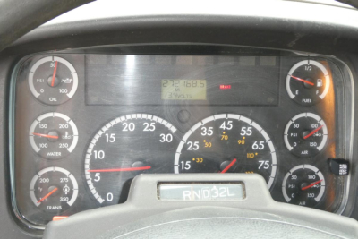 Dashboard of Freightliner M2 106 showing gauges and digital display with numbers. Visible: RND 32L on gear shifter plate. Various gauges including oil, water, fuel, air, voltmeter, and a central digital display reading 272168.5 and 13270 vo