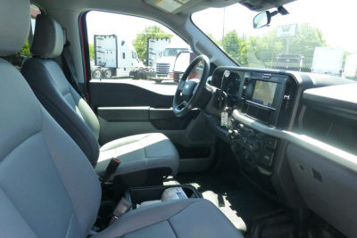 Interior view of a new 2026 Ford F-250 SD crew cab showing front seats and dashboard with infotainment screen
