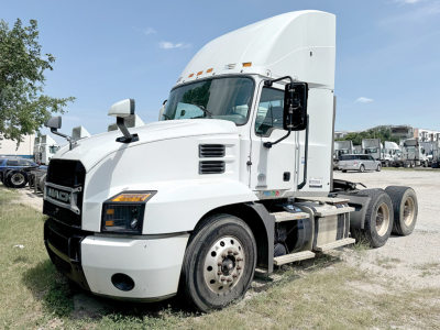 2019 Mack Anthem 64T front-left view showing truck cab and dual rear wheels with white paint and large sleeper cabin.
