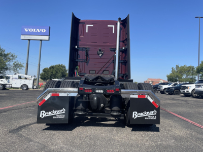 Rear view of 2026 Volvo VNL64T860 tractor showing dual mud flaps with Bruckner's Truck Equipment logos and fifth-wheel coupling.