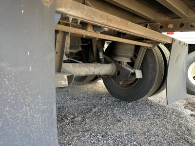 Hyundai air ride dry van trailer undercarriage showing rear axle, leaf springs, and suspension components with wheel and mud flap visible.
