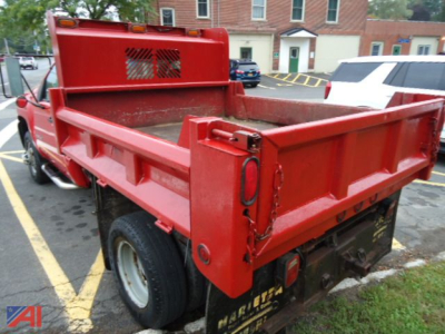 Truck bed of a red Chevrolet Silverado 2008 cab and chassis showing cargo bed and rear tailgate area.