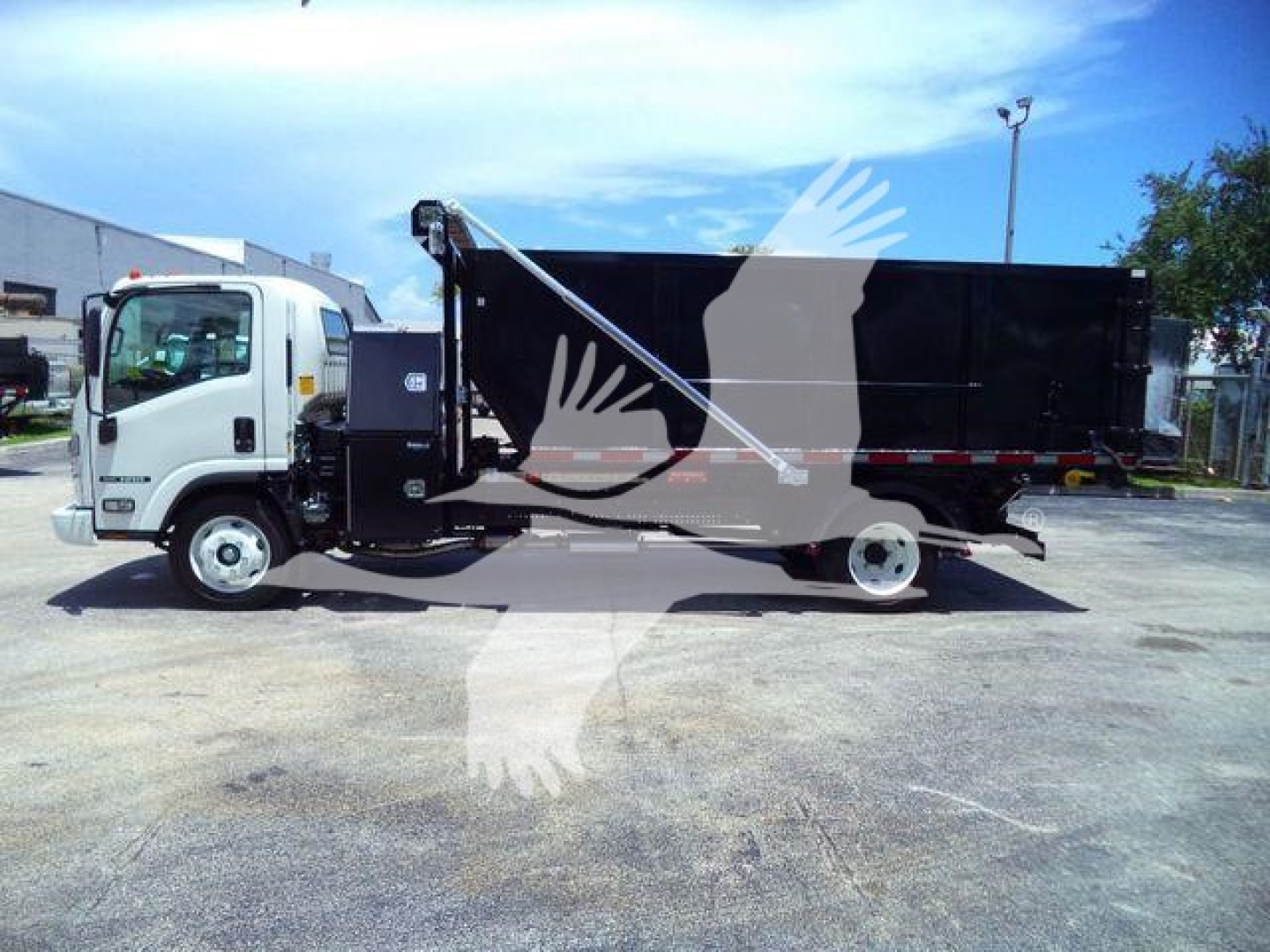 Isuzu NPR/NRR heavy-duty roll-off truck side view showing cargo bed and hydraulic arm, with no visible text on the vehicle panels.