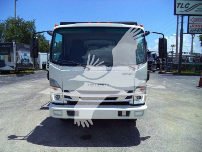 Isuzu NRR roll-off truck front view showing cab, grille, and bumper. Visible text includes Isuzu badge on the grille and Redux/engine branding? The windshield is clear; no legible small text.