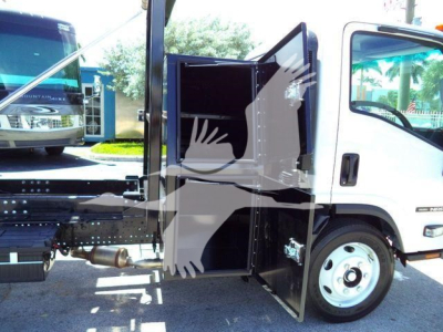Isuzu NPRR truck cab with side panel and open storage compartment showing interior shelves.