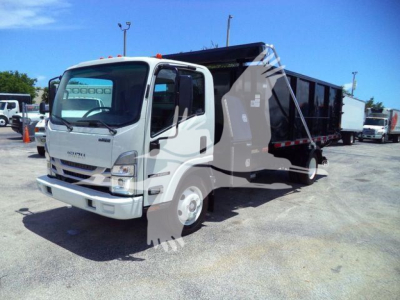 Isuzu NPR/NRR roll-off truck in a lot, white cab with black dump body, side view, stock yard background.