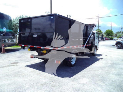 Isuzu NPR/NRR rolloff truck rear and side view showing a black dump body with reflective tape and rear hitch.