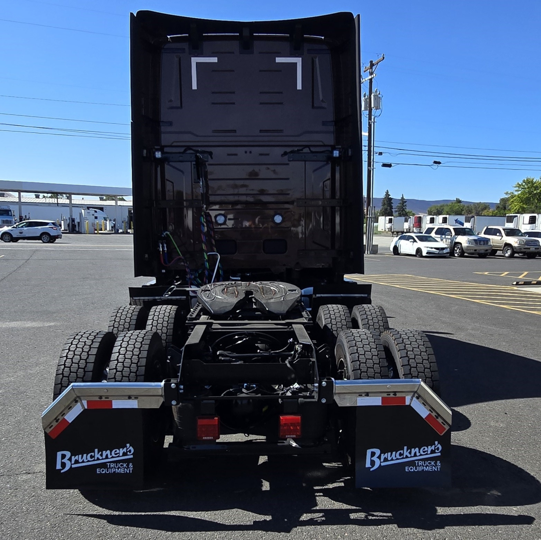 Rear view of a Volvo VNL64T860 tractor showing fifth wheel, dual rear axle setup, mud flaps with Bruckner's Truck & Equipment branding, and rear lights.