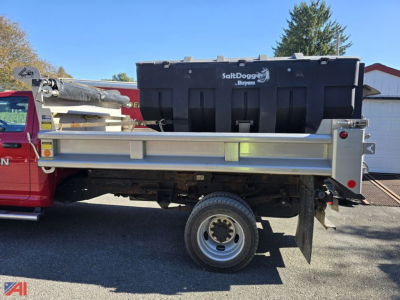 Ram 5500 dump truck with plow and sander, side view showing SaltDog Buoys storage box and hydraulic components.