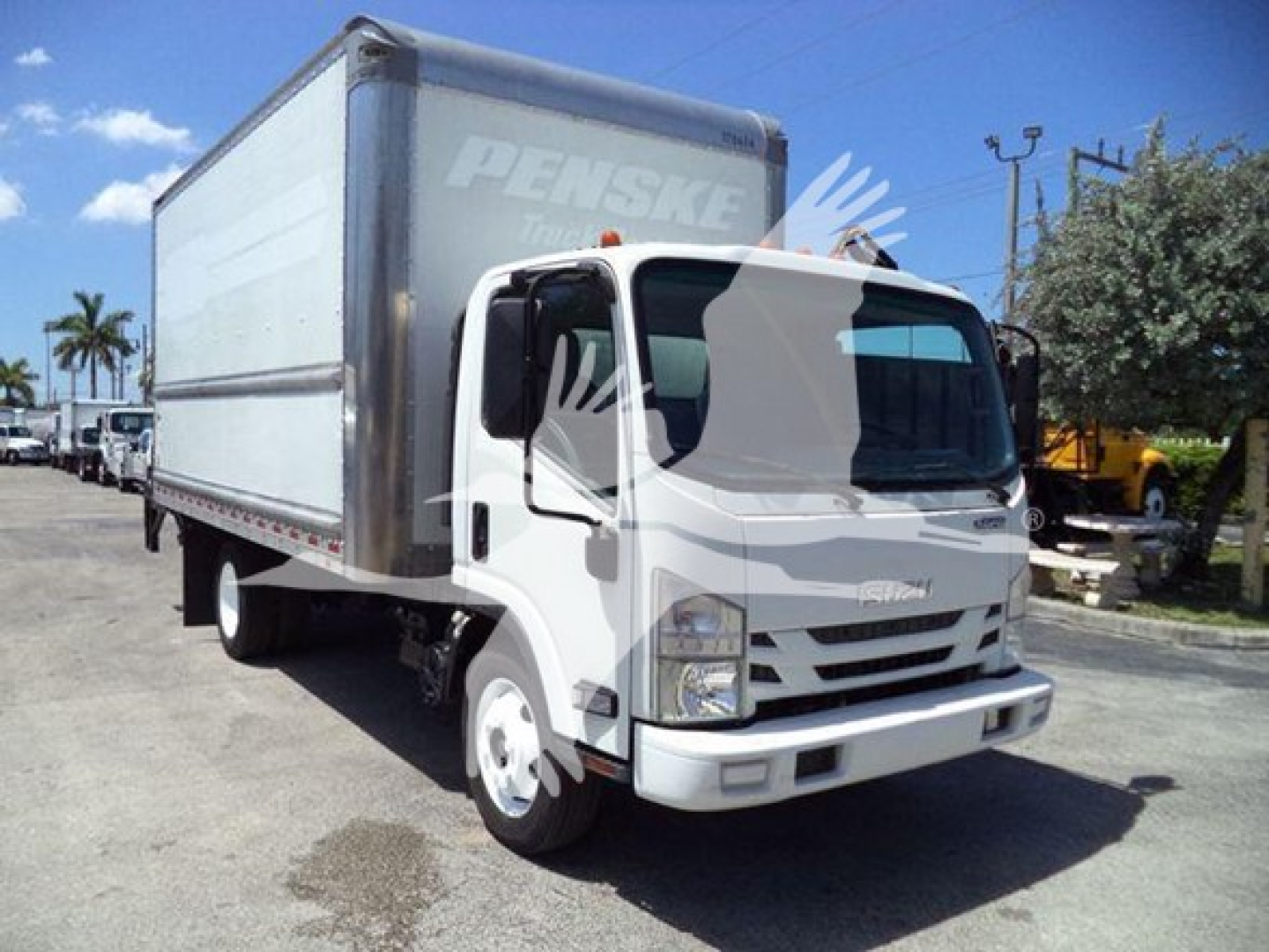Isuzu NPR HD box truck with Penske branding on cargo box showing cab front and side view.