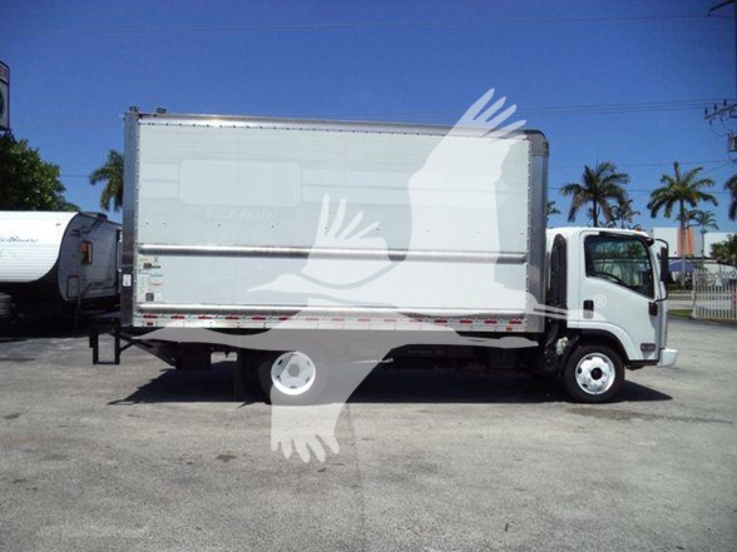 Isuzu NPR HD box truck side view showing cargo box, cab, and wheels.