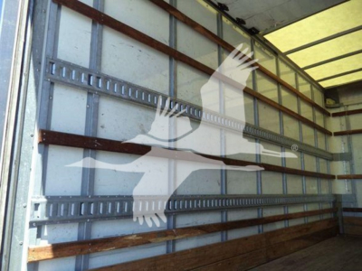 Isuzu NPR HD box truck interior wall with cargo chords and metal rails