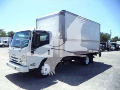 Isuzu NPR HD box truck with Penske branding showing cargo box and cab in a used truck lot.