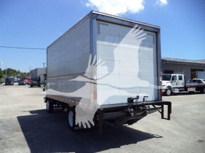Isuzu NPR-HD box truck rear view showing cargo box and rear bumper, tail lights, and dual rear wheels.