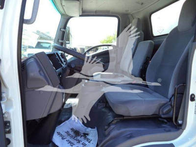 Isuzu NPR HD cab interior showing front seats and dashboard in right-hand drive? No, left-hand drive. Text not visible clearly. 