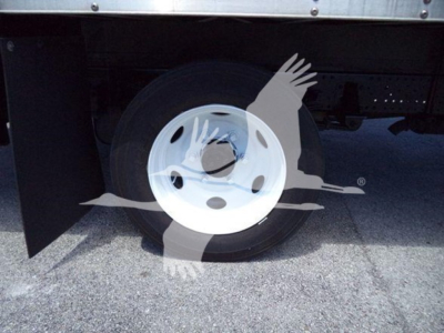 Isuzu NPR HD truck wheel and underbody in view showing rear wheel and cargo box area.