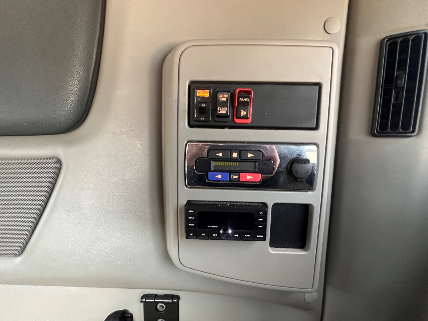 Cab interior panel showing switches and control buttons in a 2021 International LT625 truck cab.