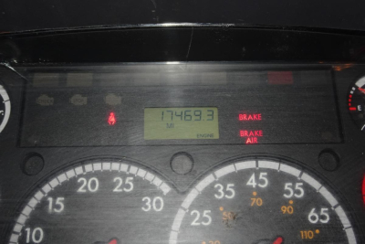 Dash panel with odometer reading 17469.3 miles? Not sure; image shows gauges and warning lights including BRAKE and ENGINE, with digital display reading 17469.3. Freightliner M2 112 cab dash view.