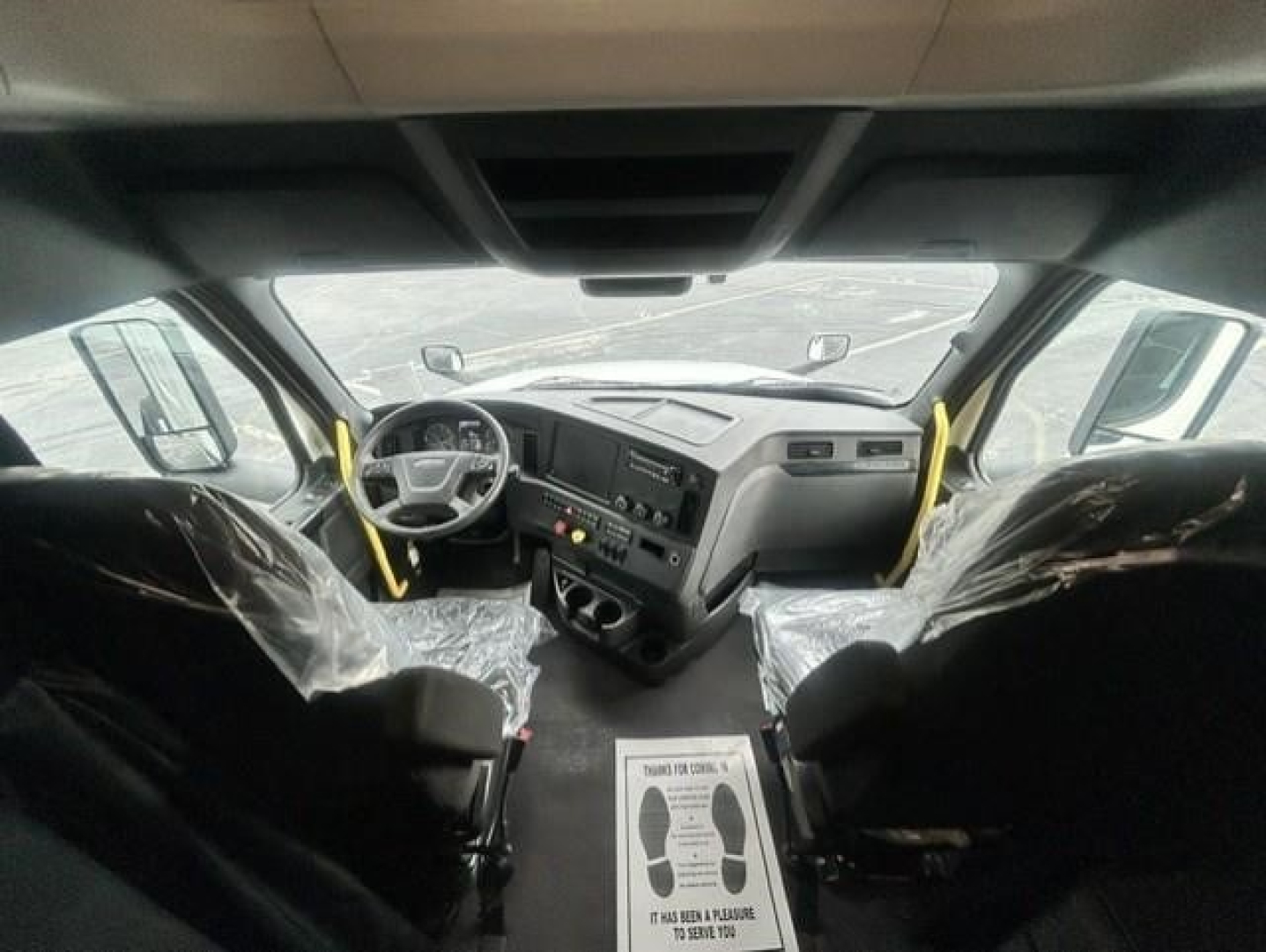 Freightliner Cascadia 126 truck interior cabin view with dash controls and seats visible.