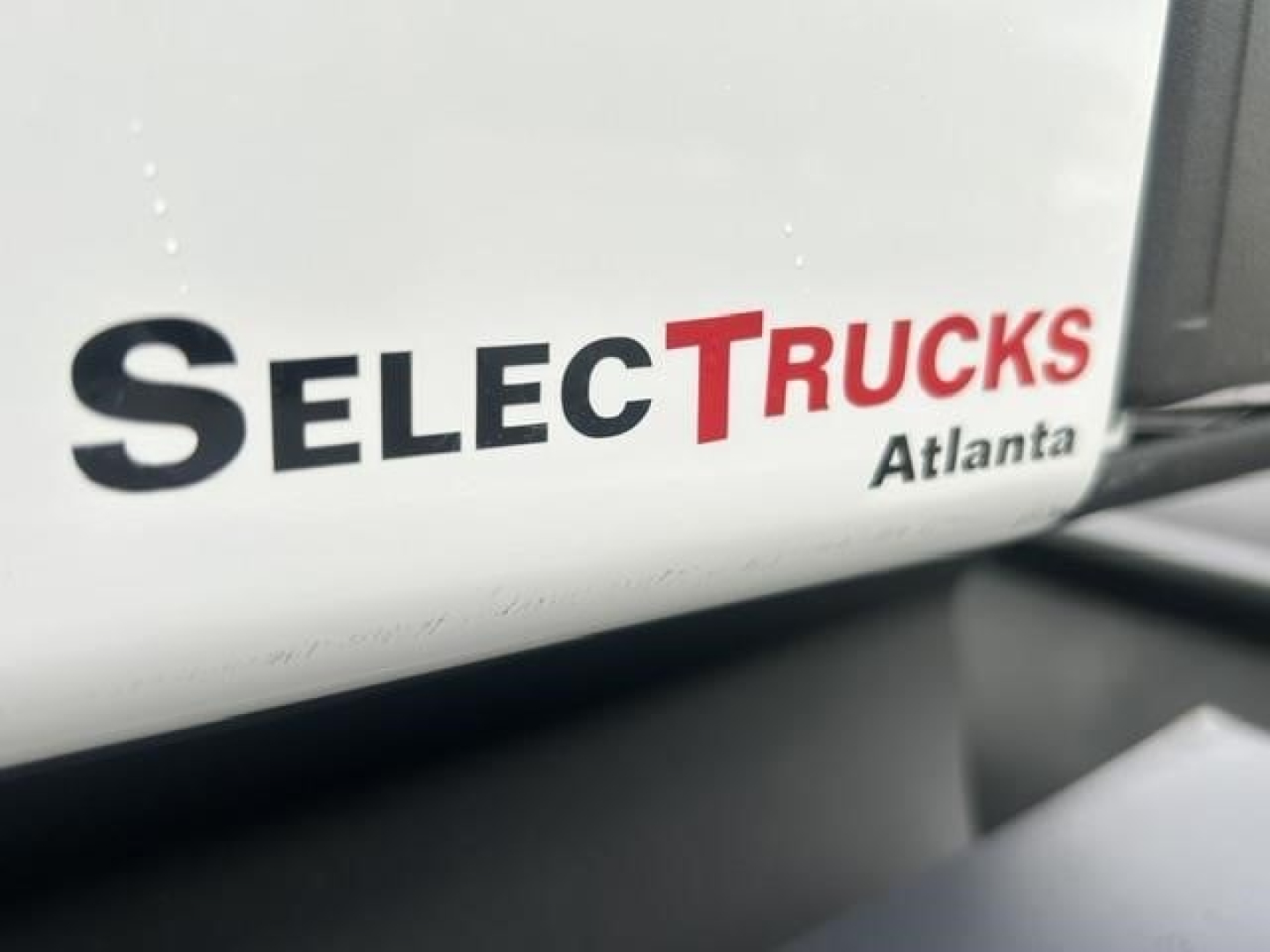 Truck cab side with SelecTrucks Atlanta logo visible