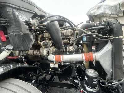 Freightliner Cascadia engine bay showing turbocharger and intercooler piping with hoses and clamps