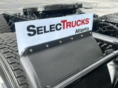 Freightliner Cascadia 126 truck chassis with a SelecTrucks Atlanta sign mounted on the sleeper area.
