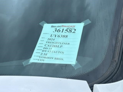 Window sticker on Freightliner Cascadia showing stock number 361582, VIN 3AKJHHDR6RSUY6388, model DT-12, 2.16 TD-? engine details and Gordon Bros. dealer information.