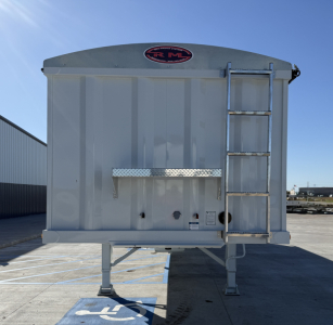 Armor Lite 40' steel grain hopper trailer front view with ladder on right and RML logo sticker.