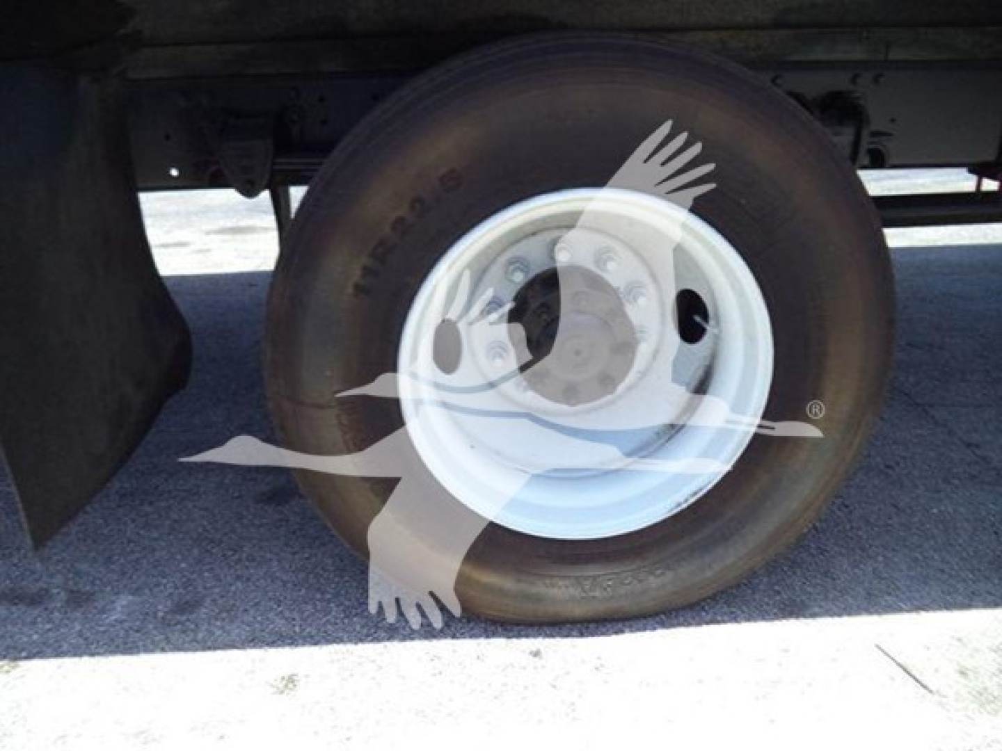Wheel and tire close-up on a 2019 Hino 268A refrigerated truck showing wheel rim and tire details.