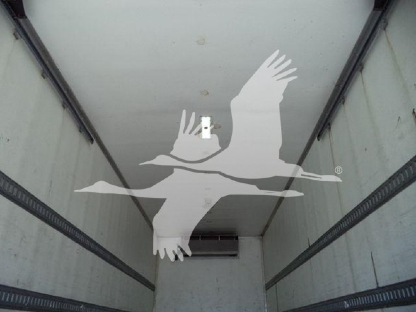 Inside trailer refrigerated truck cargo area with Hino 268A branding overlay.