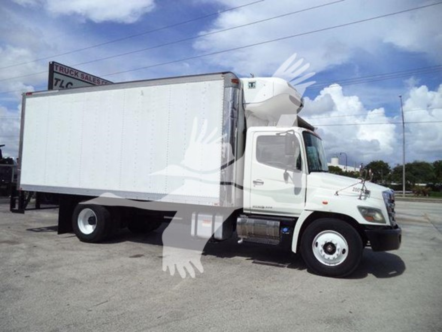 Hino 268A refrigerated box truck side view with white cab and cargo box