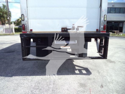 Rear view of a refrigerated truck with a metal platform at the back, bumper supports, and dual taillights.