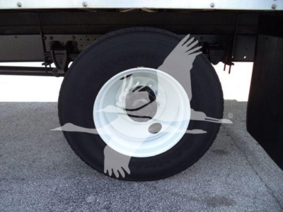 Hino 268A wheel and undercarriage view with spare tire and rim visible