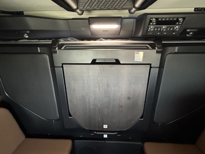 Cab interior of a Mack PR64T76H sleeper truck showing dashboard area and center rear fuselage panel.