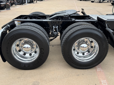 Kenworth T680 chassis showing dual rear tandem wheels with Goodyear Endurance tires and chrome hubcaps, undercarriage frame rail and fifth wheel mounting area visible.