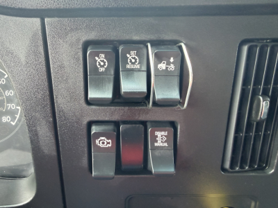 Dashboard switches and controls of a Kenworth T380 shown near the instrument cluster.