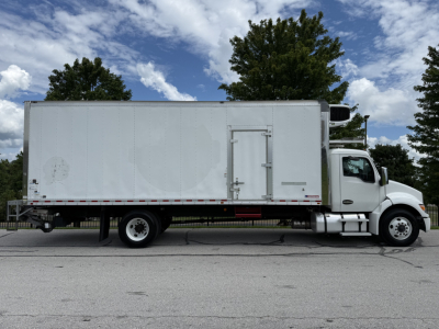 Kenworth T380 refrigerated box truck side profile showing cargo box and cab with wheel and door.
