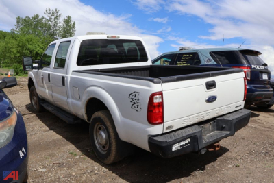 Ford F-250 Super Duty pickup truck rear and side view showing bed with tailgate, white color, 4x4 badge, and F-250 model lettering