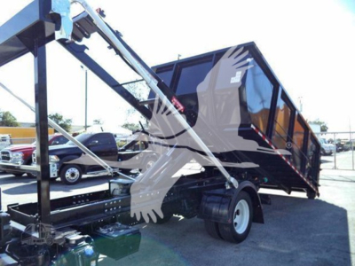 Isuzu NRR dump truck in a roll-off configuration showing hydraulic arms and a black dump body with white wheels.