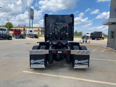 Peterbilt 389 rear view showing mudflaps and dual fuel tanks.